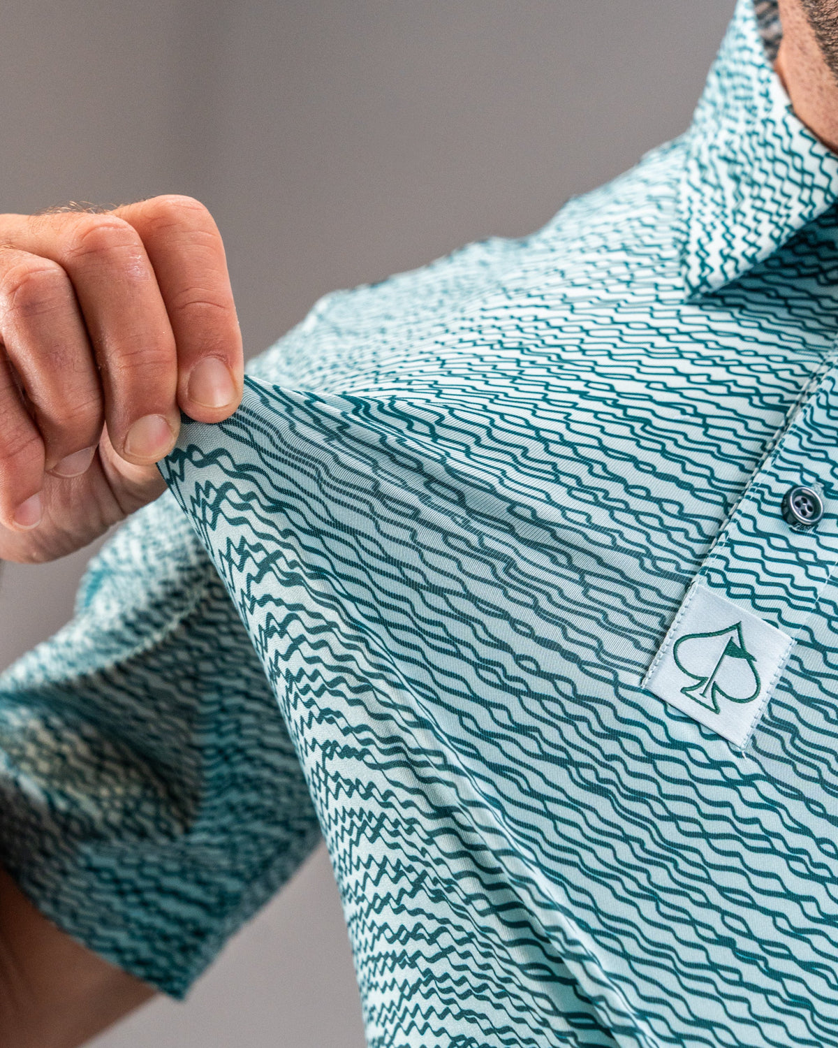 Squiggle Teal Golf Polo
